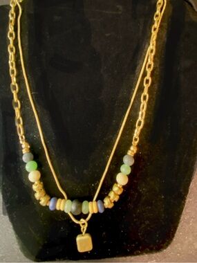 Layered necklaces with gold-toned chains, natural stones, glass beads & pendant
